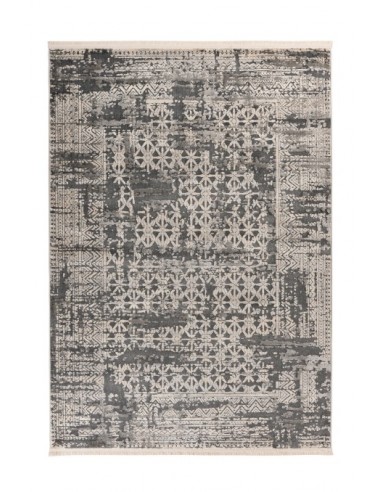 Tappeto moderno grigio con design tribale e resistente al tempo.